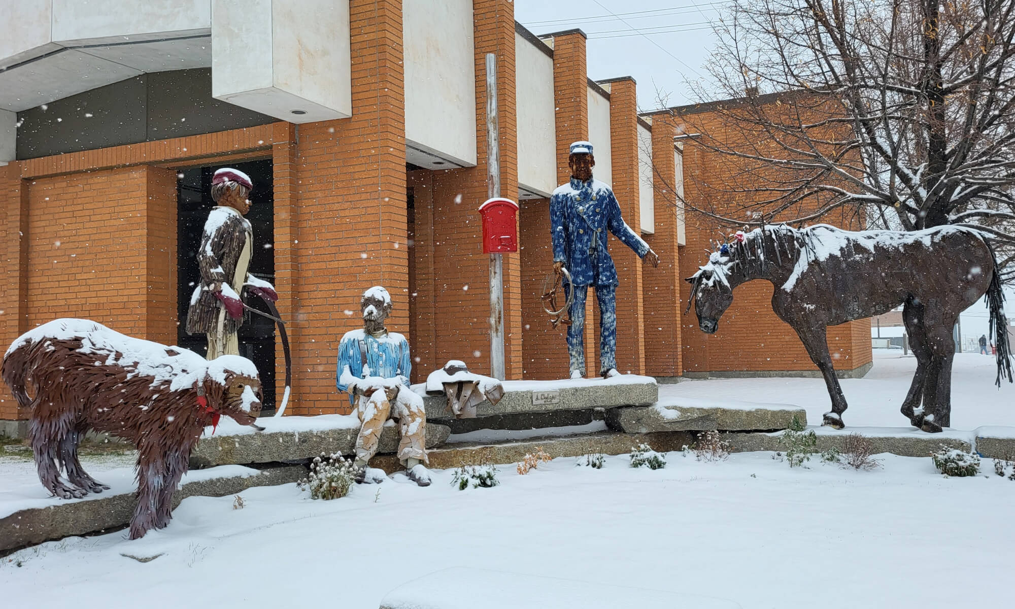 Jim Dolan sculpture for the Memorial of the Great Warehouse Explosion of Butte 1895, covered with snow.