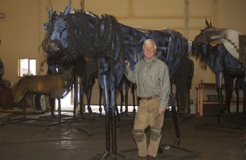Image of Jim Dolan in front of "Bleu Horse" in his studio