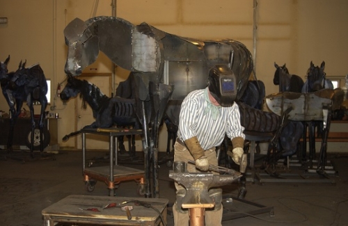Image of Jim Dolan building a "bleu horse" in his studio